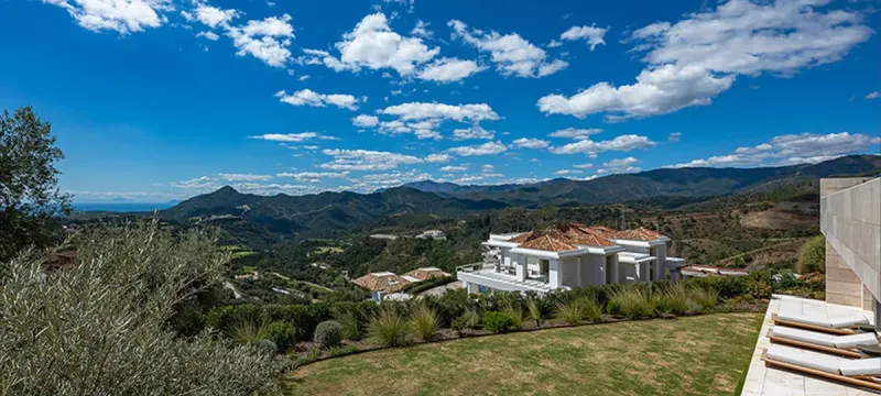 Aerial view of La Zagaleta showing villas, greenery, and road layout