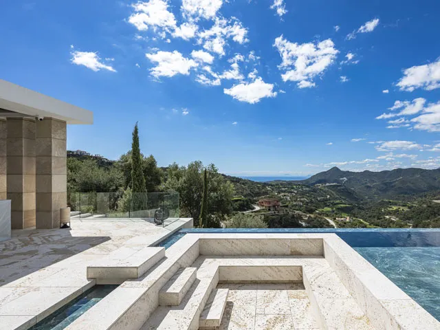Relaxing pool area at Villa Kaizen, La Zagaleta, surrounded by water